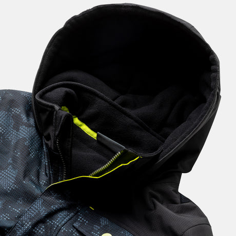 A close-up of the Free Country Boys' Multi Rip Stop Boarder Jacket, featuring a blue digital camo pattern on water-resistant recycled polyester, with black fleece lining and a yellow-accented partially unzipped zipper.