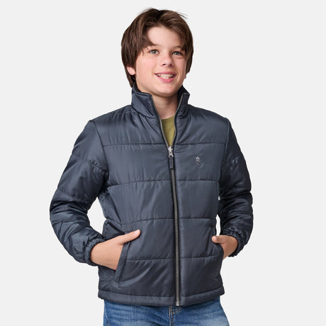 [River is wearing size M.] Boys' black 3-in-1 jacket with zip-out puffer liner and hood — versatile cold-weather system with chest logo and multiple pockets