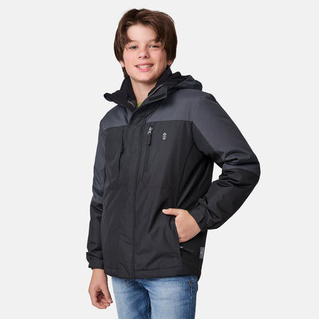 [River is wearing size M.] Boys' black 3-in-1 jacket with zip-out puffer liner and hood — versatile cold-weather system with chest logo and multiple pockets