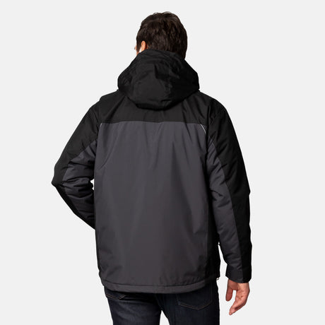 A person wears the Clearance Men's FreeCycle® Jack Frost 3-in-1 Systems Jacket in black and dark gray, standing with one hand on their hip against a plain light background.
