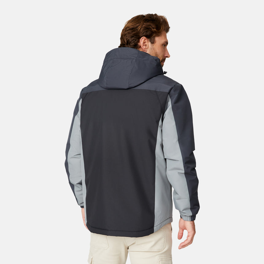 [Matt is 6'2" wearing size M.] Men’s Free Country black zip-front jacket with gray hood, sleeves, and side panels—features dual zippered chest pockets and side pockets for practical, cold-weather functionality. Paired with beige pants for a clean, transitional outdoor look.