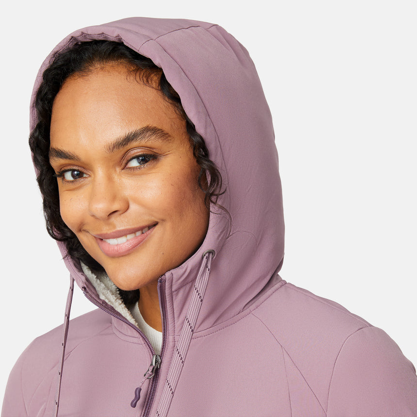 [Angelique is 5'10" wearing size S.] Women’s Free Country light purple hooded jacket with full-zip closure, drawstring hood, and dual hand pockets—sherpa lined for added warmth and comfort. Paired with dark jeans for a cozy, casual cold-weather look.