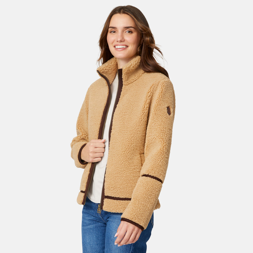 [Jessica is 5'9.5" wearing size S.] Woman wearing a camel-colored jacket with dark brown accents on a white background