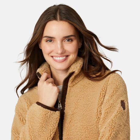 [Jessica is 5'9.5" wearing size S.] Woman wearing a camel-colored jacket with dark brown accents on a white background