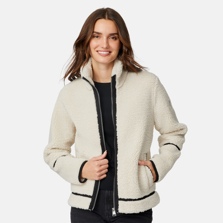 [Jessica is 5'9.5" wearing size S.] Woman wearing a cream-colored jacket with black accents on a white background