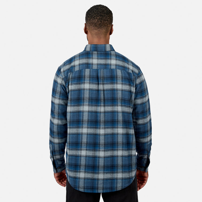 [Model is wearing size M.] Back view of a man wearing a blue plaid fleece lined flannel shirt showing the collar and plaid pattern