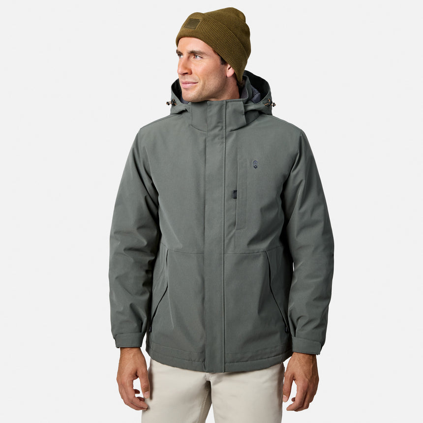 Man wearing olive knit beanie and gray Denali insulated jacket with hood looking to the left