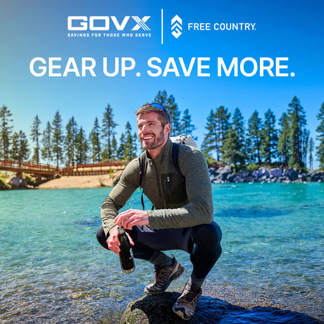GOVX and Free Country — Gear up, save more. Savings for those who serve. Man crouching by a clear mountain lake