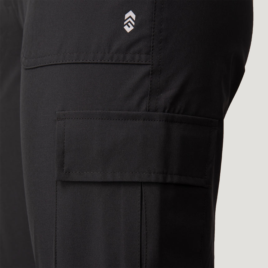 Close-up of Free Country Women’s Get Out There Fleece Lined Jogger highlighting a large cargo pocket, small white logo above it, and fabric texture with visible stitching. These fleece-lined joggers offer water resistance, durability, and versatility.