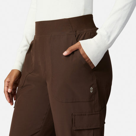A person wears Free Country Women’s Get Out There Fleece Lined Jogger and a white long-sleeve top, with one hand in the front pocket, shown from mid-torso to upper thigh against a plain background.