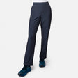 A woman wearing Free Country Women’s Get Out There Fleece Lined Pants in Charcoal, shown from the waist down against a plain white background, paired with blue athletic shoes.
