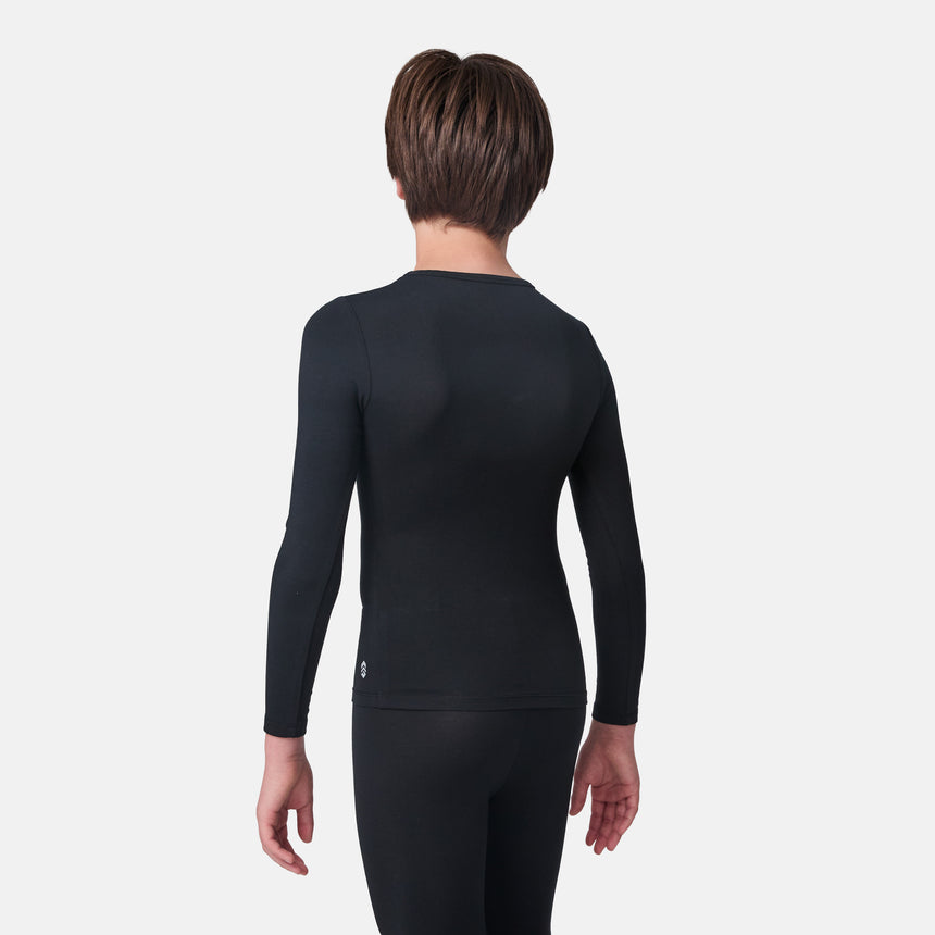 Child wearing a black long-sleeve base layer shirt and black base layer pants on a white background