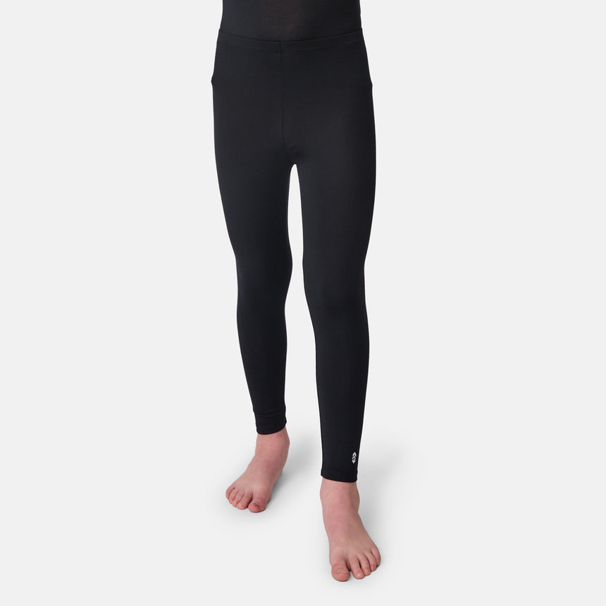 Child wearing a black long-sleeve base layer shirt and black base layer pants on a white background