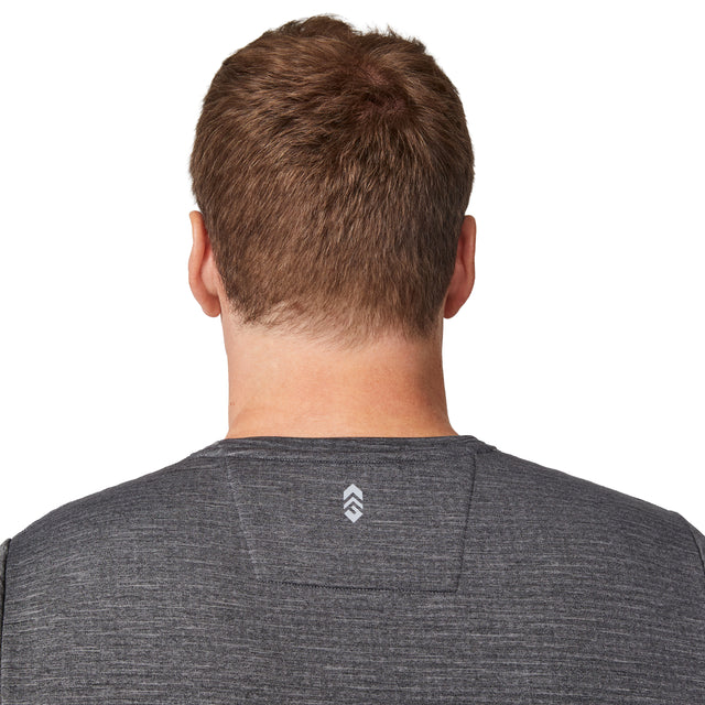 A person with short brown hair, seen from behind, is wearing the Free Country Men's Force Grid Fleece Base Layer Top in heather gray, featuring a small white logo at the top center of the back.