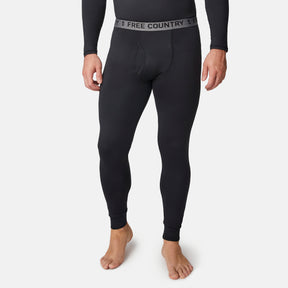 A person stands barefoot against a plain white background, wearing black Men’s Microtech® Heat Cocarber® Coffee Base Layer Bottoms from Free Country. Crafted with moisture-wicking fabric, these leggings feature a waistband emblazoned with the Free Country logo.