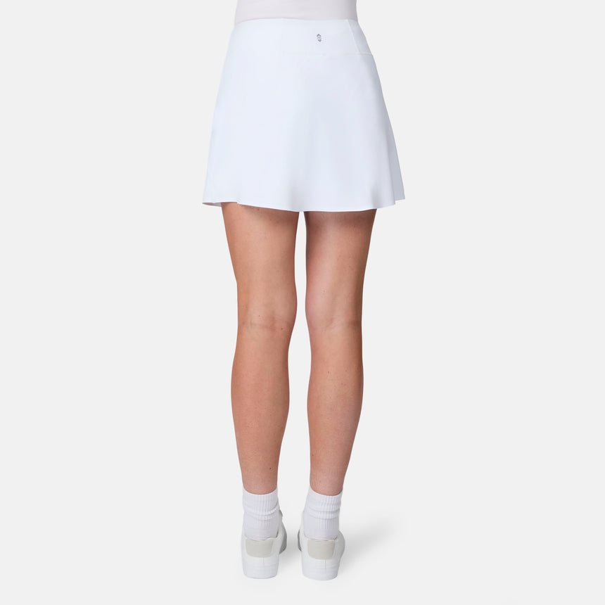 [Model is wearing size S] White tennis skirt worn by a person on a white background