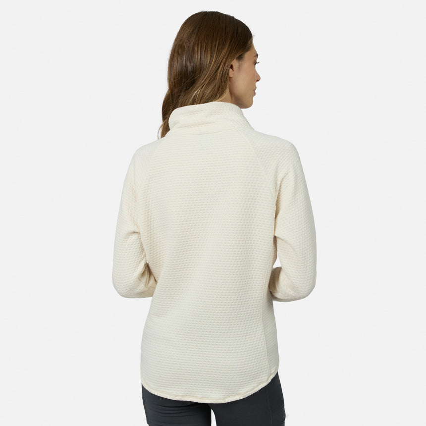 Back view of a woman wearing a cream-colored, seamless quilting Women’s UltraFill Cowl Neck Top with long sleeves.