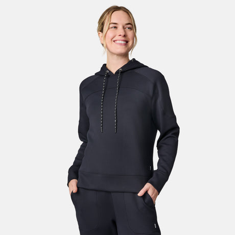 Woman wearing a dark navy Sueded Lush Pullover Hoodie with drawstrings.