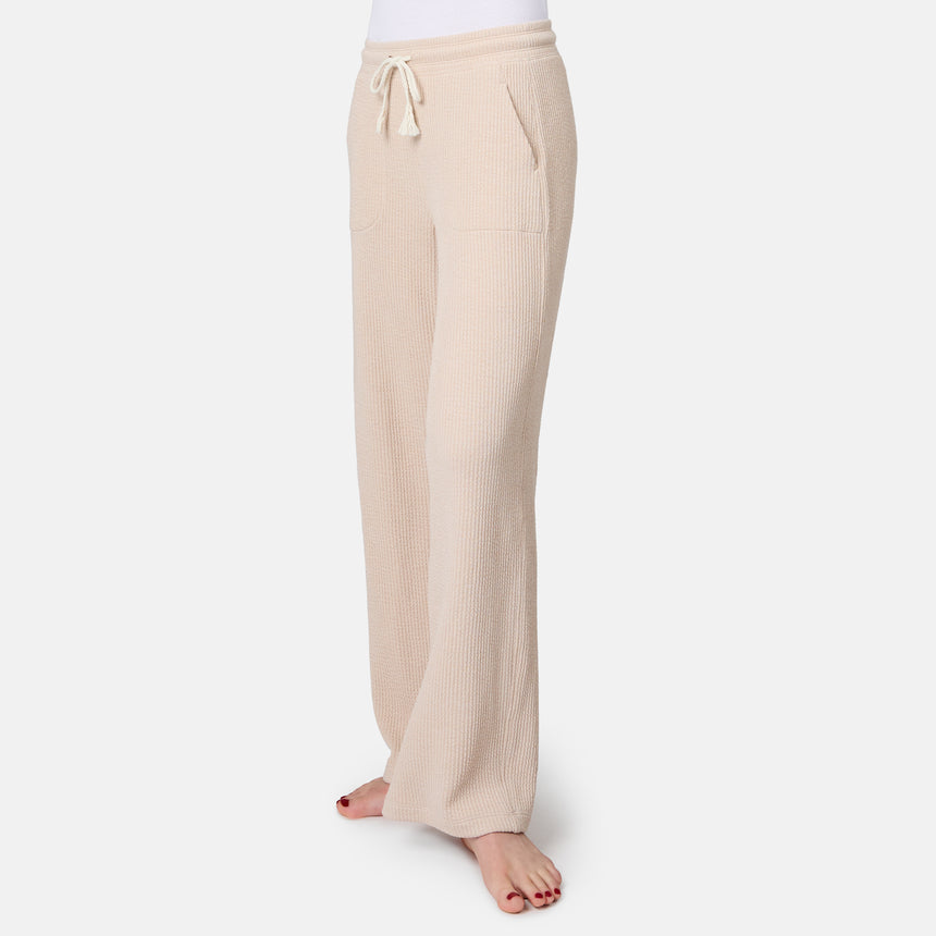 [Model is 5'10" wearing size S] Beige ribbed lounge pants on a white background