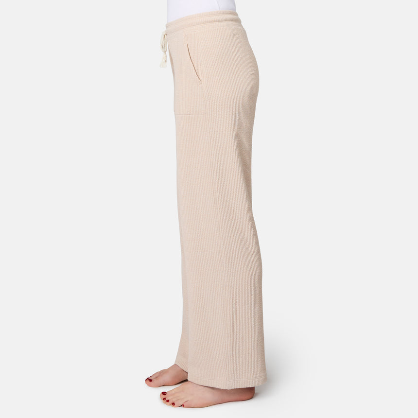 [Model is 5'10" wearing size S] Beige ribbed pants on a white background