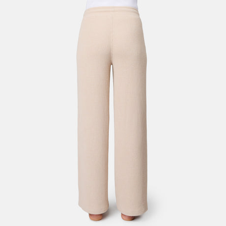 [Model is 5'10" wearing size S] Beige ribbed pants on a white background
