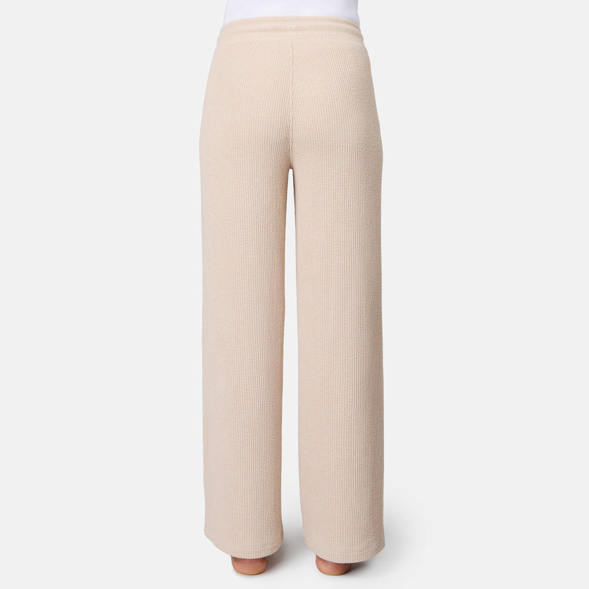 [Model is 5'10" wearing size S] Beige ribbed pants on a white background