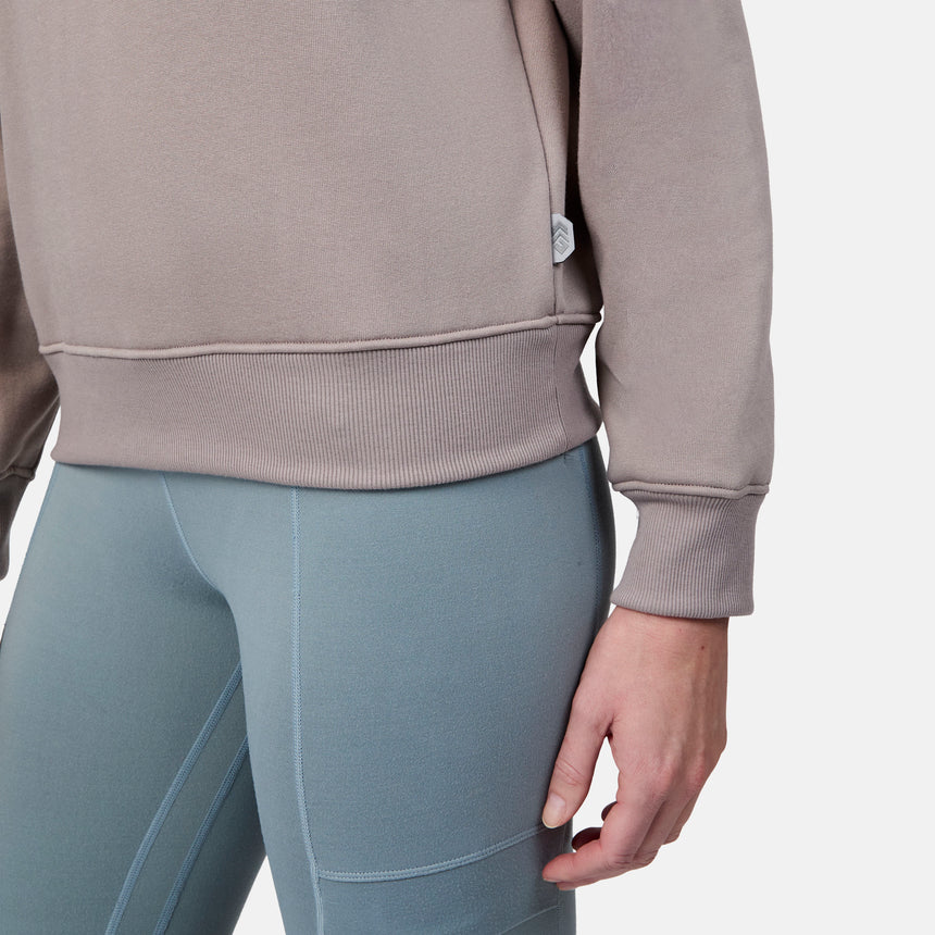 [Emily is 5'9" wearing size S] Person wearing a beige sweatshirt and light blue leggings on a white background