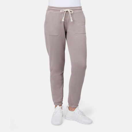 [Model is wearing size S] Beige sweatpants worn by a person on a white background