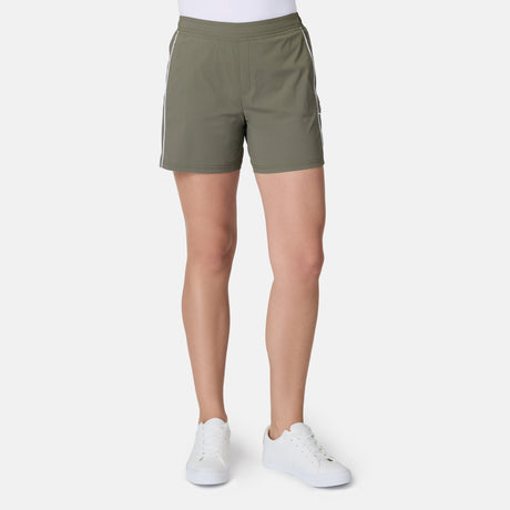 [Model is wearing size S] Person wearing olive green shorts with white stripes on a white background