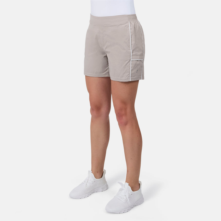 [Model is wearing size S] Person wearing beige shorts with white accents on a white background