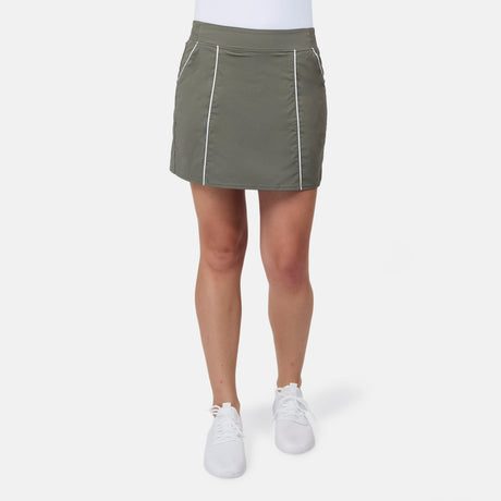 [Model is wearing size S] Person wearing a green skirt with white accents on a white background