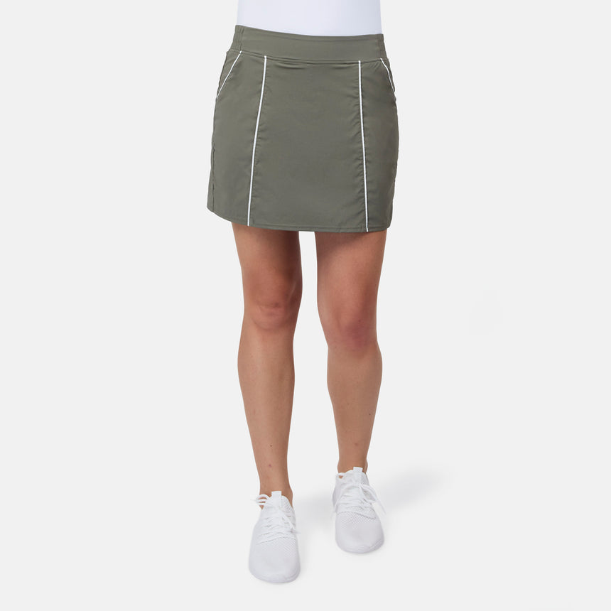 [Model is wearing size S] Person wearing a green skirt with white accents on a white background