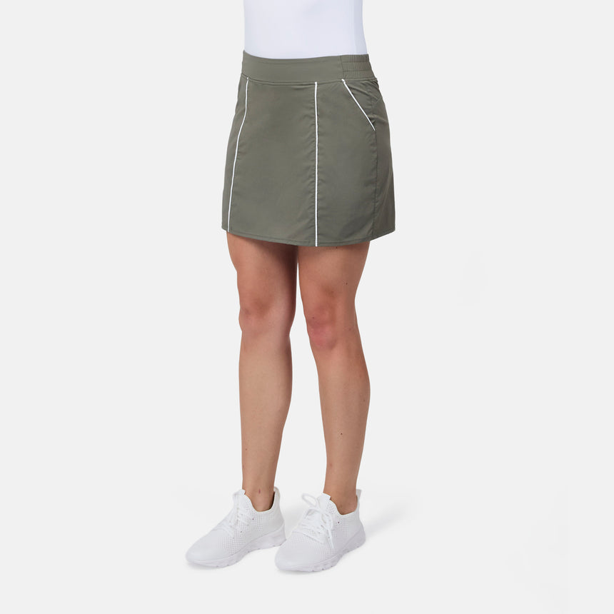 [Model is wearing size S] Person wearing a green skirt with white accents on a white background