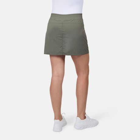 [Model is wearing size S] Person wearing a green skirt and white shoes on a white background
