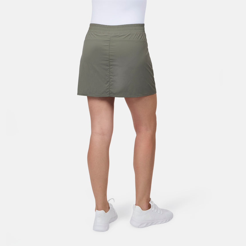 [Model is wearing size S] Person wearing a green skirt and white shoes on a white background