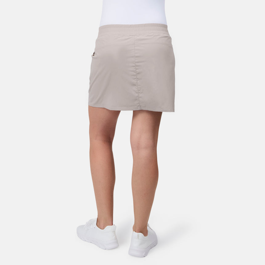 [Model is wearing size S] Beige skirt worn by a person on a white background