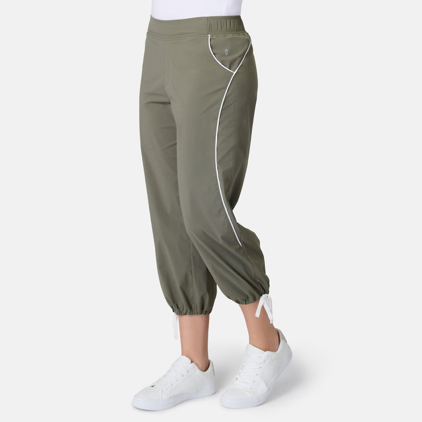 [Model is wearing size S] Green pants with a white stripe worn by a person on a white background
