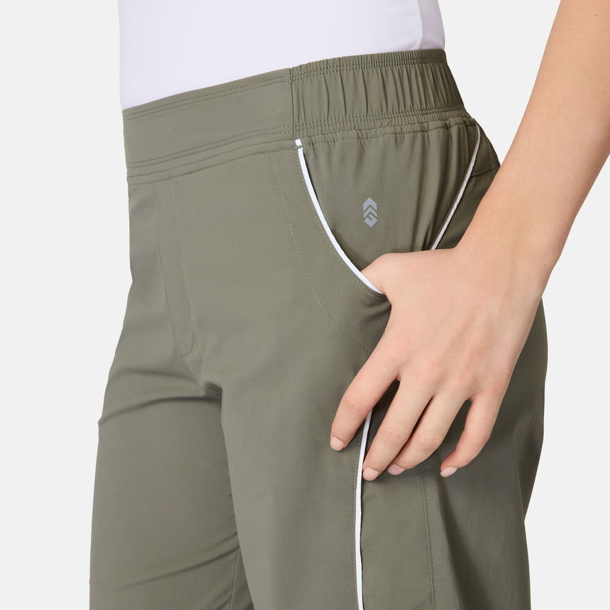 [Model is wearing size S] Green athletic pants with a brand logo on a white background