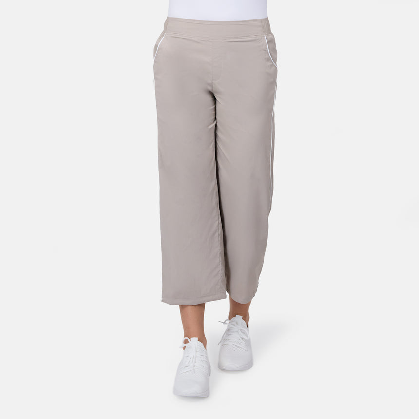 [Model is wearing size S] Beige pants worn by a person on a white background