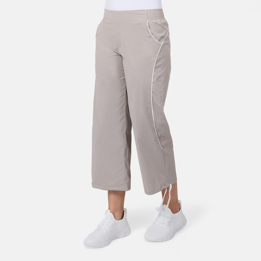 [Model is wearing size S] Beige wide-leg pants worn by a person on a white background