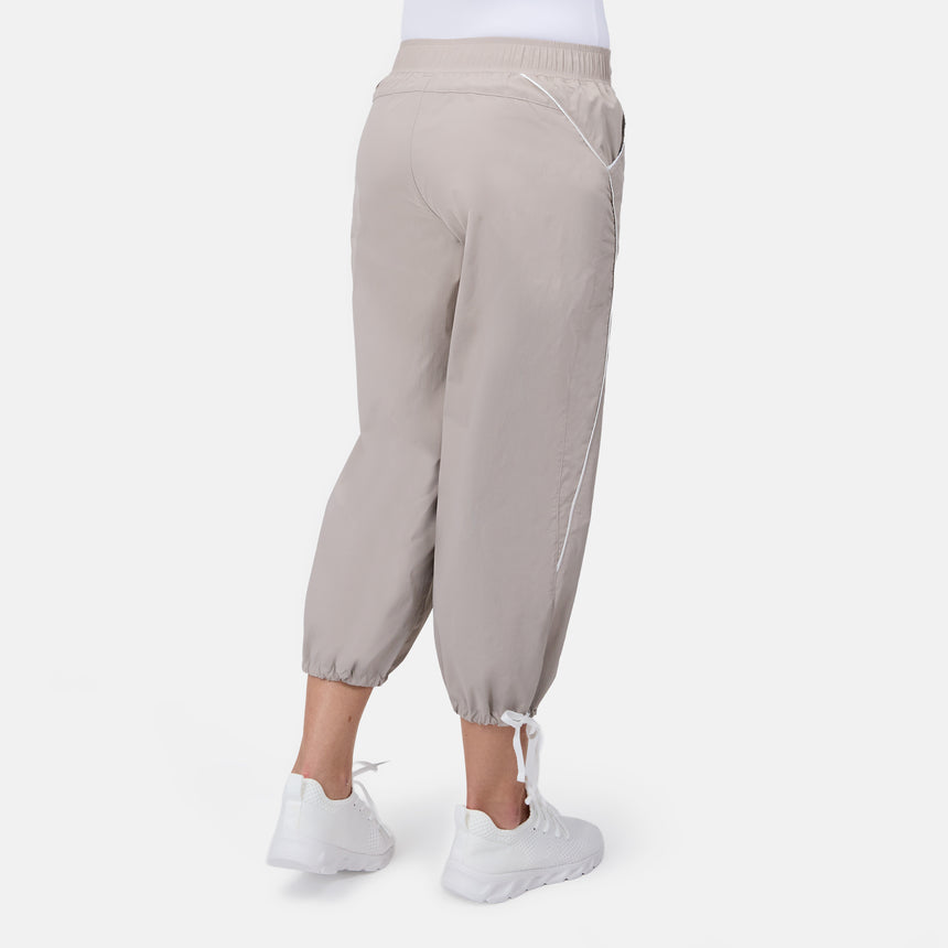 [Model is wearing size S] Beige jogger pants worn by a person on a white background