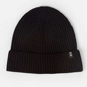 The Men's Rib Knit Cuff Beanie by Clearance is a black hat with a folded brim and small side tag featuring a white chevron logo, shown against a white background.