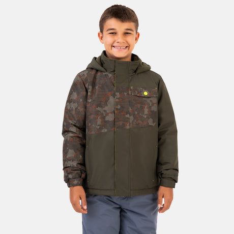 A boy smiles while wearing a Boys’ Multi Rip Stop Boarder Jacket in olive, featuring a water-resistant finish and a camo-patterned chest panel and sleeve.