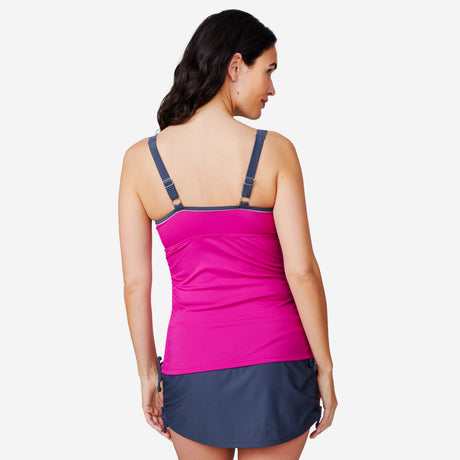 A woman is seen from the back wearing a Clearance Women's Double Strap Tankini Top in pink with dark adjustable straps and a dark gray swim skirt. The quick-drying fabric suits active days, set against a plain white background.
