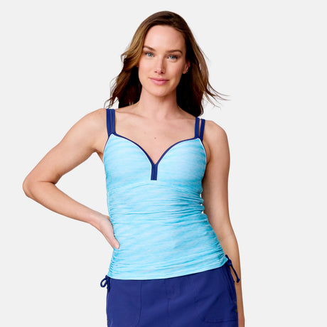 A light-skinned woman with long brown hair models the Clearance Women's Textured Stripe Double Strap Tankini Top in light blue with dark blue accents and quick-dry fabric, paired with dark blue bottoms, against a plain white background.