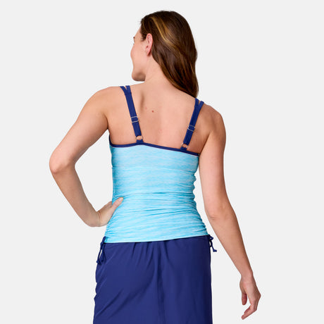 A woman with long brown hair is shown from the back against a white background, wearing a Clearance Women's Textured Stripe Double Strap Tankini Top in light blue and a navy swim skirt, both made from quick dry fabric.
