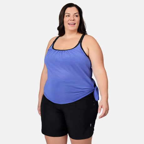 [Melissa is 5'10" wearing size 1X] Woman wearing a blue tank top and black shorts on a white background
