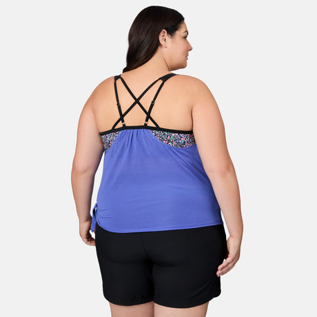 [Melissa is 5'10" wearing size 1X] Woman wearing a blue tank top with floral straps and black shorts on a white background