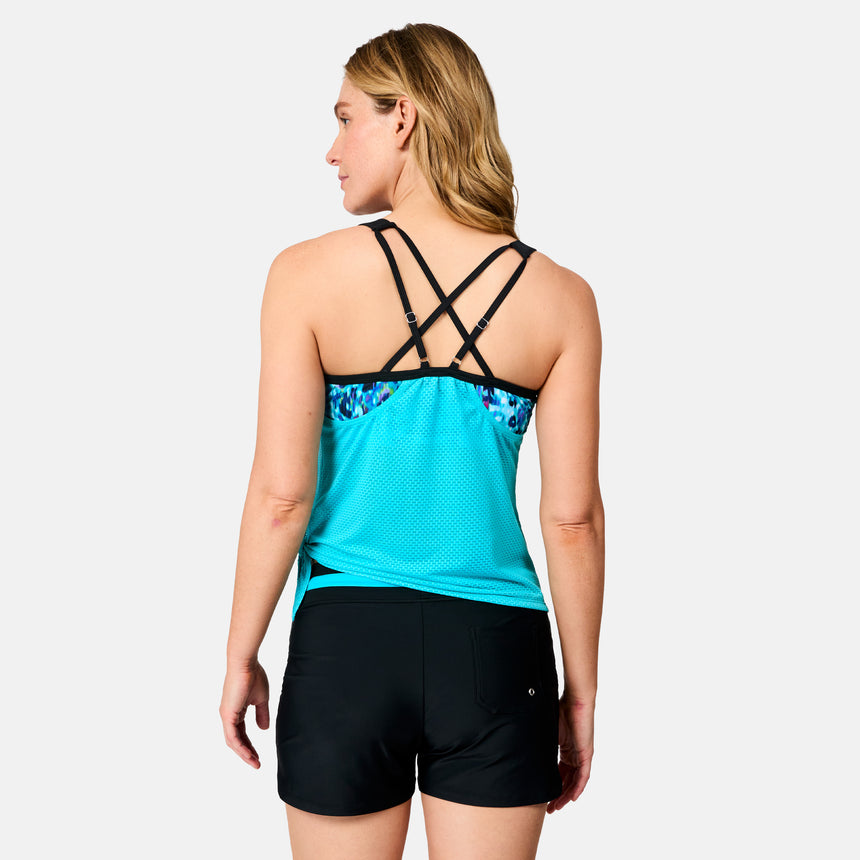 [Brooke is 5'9" wearing size S] Woman wearing a blue tank top with floral details and black shorts on a white background