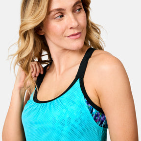 [Brooke is 5'9" wearing size S] Woman wearing a blue tank top with black trim on a white background